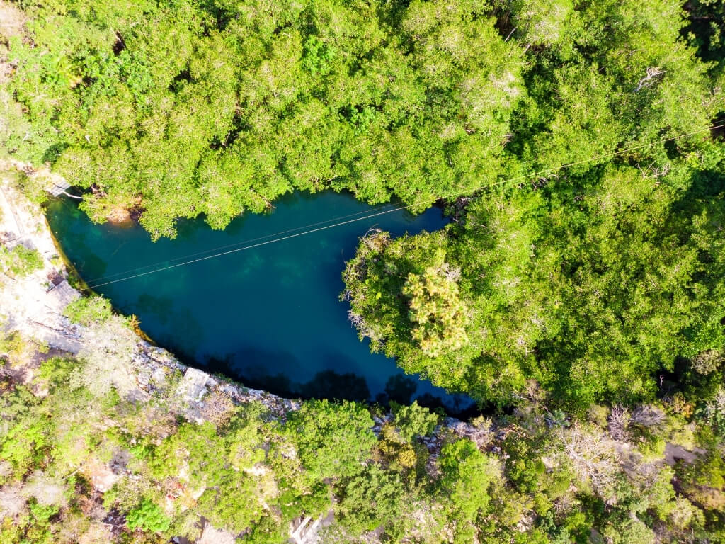 aerial view of Cenote Jaguar, another cenote found within Parque Dos Ojos.