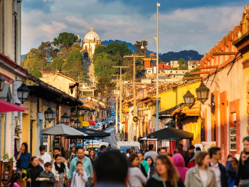 Busy streets of San Cristobal de las Casas in Chiapas Mexico, full of people and lined with colorful colonial buildings