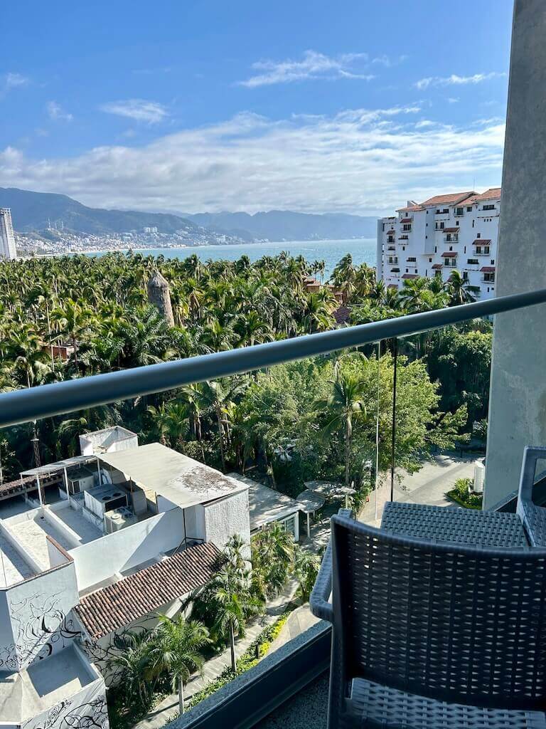 looking over the back of a chair toward Banderas Bay from the balcony of the Hotel Mio Vallarta