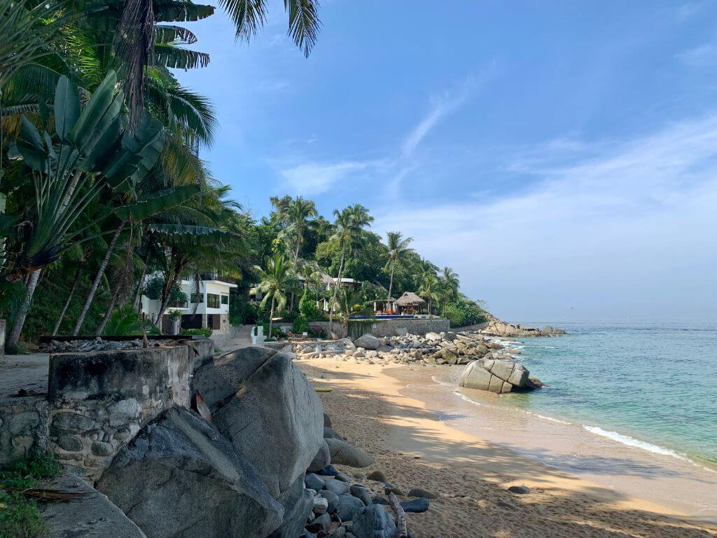 Casitas Maraika resort in the distance with a sandy beach and the path to Las Animas in the foreground