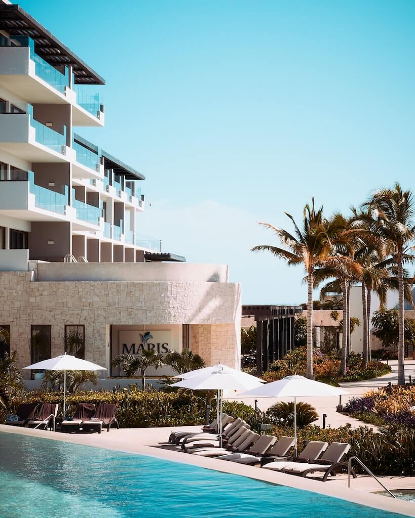 sun loungers by the pool at a mexico beach resort