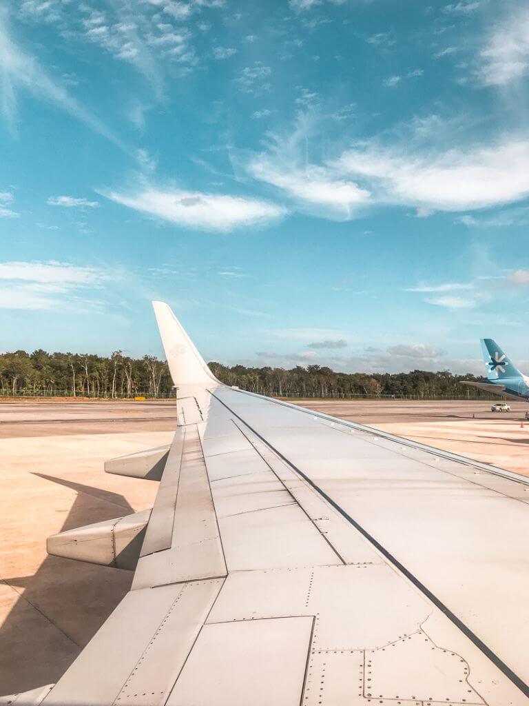 view over an airplane wing at the airport in mexico city