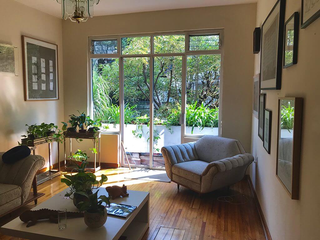 A mid-century style living room in a Mexico City airbnb