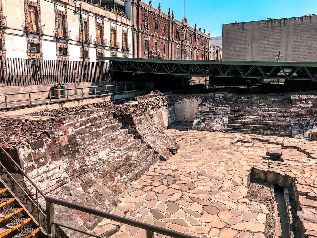 templo mayor ruins with a colonial building in the background