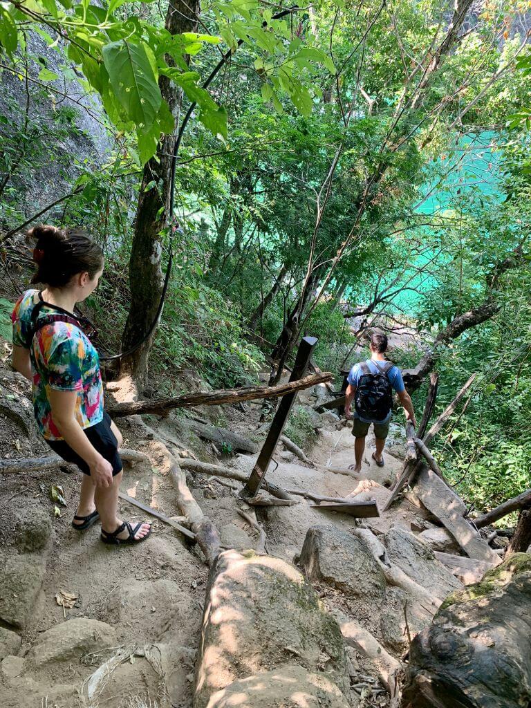 hikers descend a steep path toward Playa Colomitos, a stop on the way to Playa Las Animas