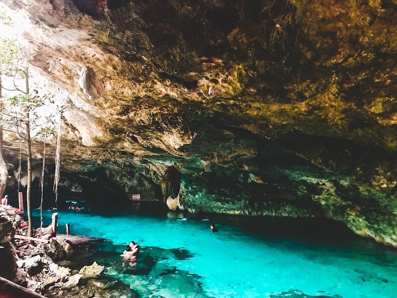 swimmers in the crystalline water of Dos Ojos Cenote