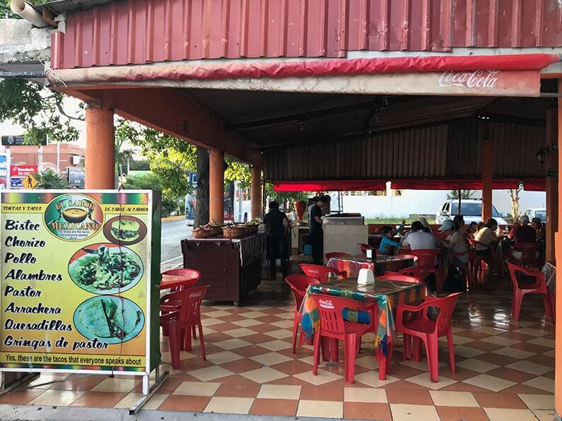 a quality taco shop-- an open air restaurant with plastic chairs and plastic tablecloths