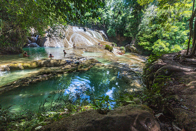 Swimmers frolic in the pools at the bottom of the Roberto Barrios falls, some of the most popular waterfalls in Chiapas.