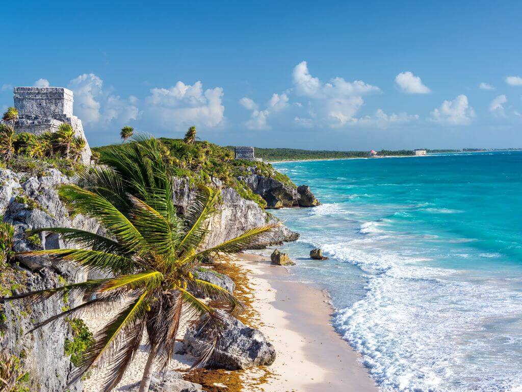 view of Tulum ruins along the beach in Tulum, Mexico