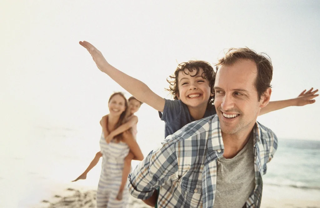 Family playing at the beach