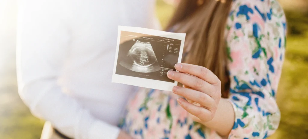 Couple showing an ultrasound